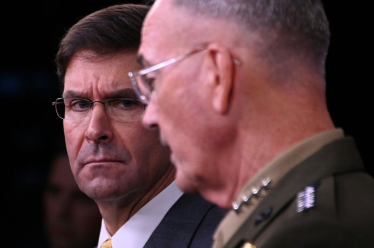 US Defense Secretary Mark Esper (left) listens to the Chairman of the Joint Chiefs of Staff General Joseph Dunford during a press conference at the Pentagon