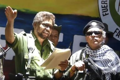 Former senior FARC commander Ivan Marquez (left) and rebel colleague Jesus Santrich, pictured at an undisclosed location in a TV grab taken from YouTube on August 29, 2019, announce that they are taking up arms again