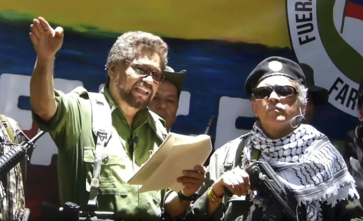 Former senior FARC commander Ivan Marquez (left) and rebel colleague Jesus Santrich, pictured at an undisclosed location in a TV grab taken from YouTube on August 29, 2019, announce that they are taking up arms again