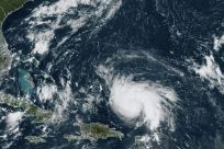 Tropical Storm Dorian is pictured approaching north-northwest of Puerto Rico in the Caribbean on its movement toward Florida, in a satellite image obtained from NOAA/RAMMB
