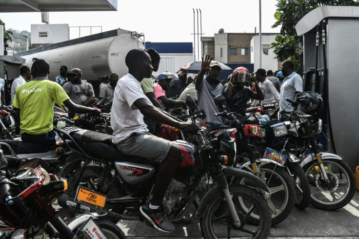 Motorcycle riders in Port-au-Prince, Haiti, wait in line to buy gasoline which is in increasingly short supply