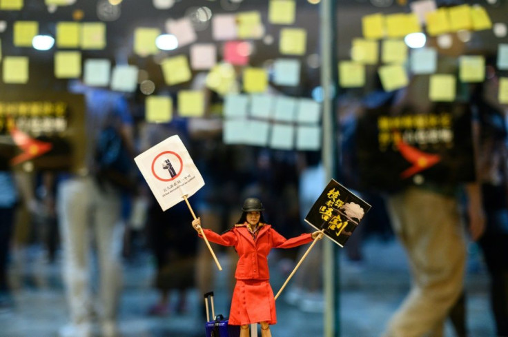 A flight attendant doll is placed inside a shopping mall during a rally to support Cathay Pacific staff after the airline sacked some employees for supporting the protests