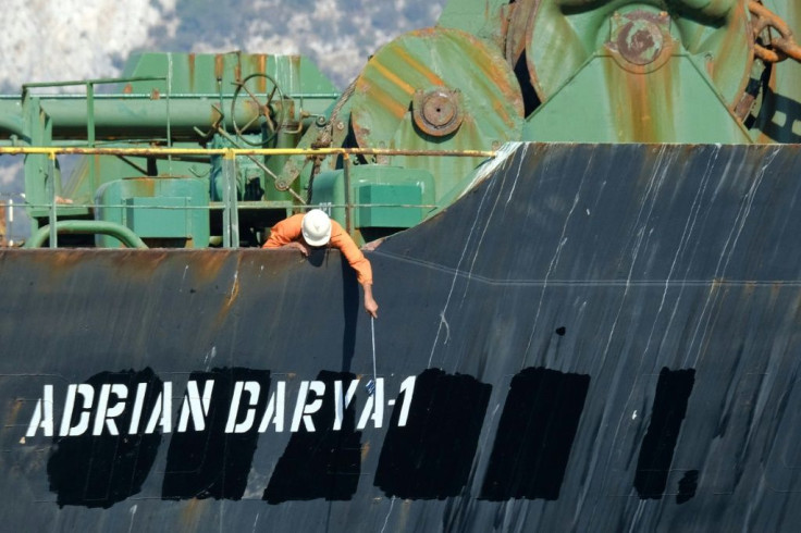 Crew member checks the new name of Iranian oil tanker Adrian Darya, formerly known as Grace 1, off the coast of Gibraltar