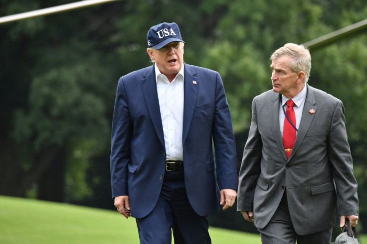 US President Donald Trump pictured with Coast Guard Rear Admiral Peter Brown, upon arrival at the White House on September 1, 2019