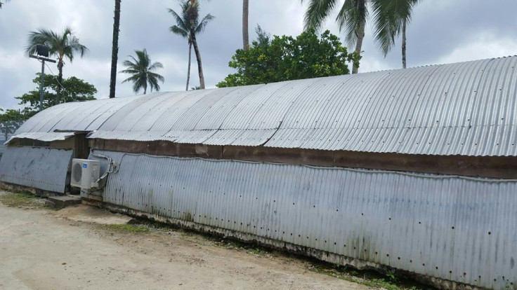 Papua New Guinea has cancelled a contract with an Australian-backed firm running refugee camps on Manus island