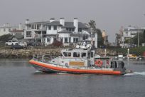 A Coast Guard crew leaves US Coast Guard Station Channel Islands in Oxnard, California, heading to the scene of a boat that burned and sank off Santa Cruz Island leaving more than 30 people missing and feared dead