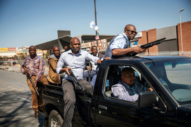 South African Police patrols clashed with rioters the Johannesburg township of Alexandra after migrant businesses were targeted