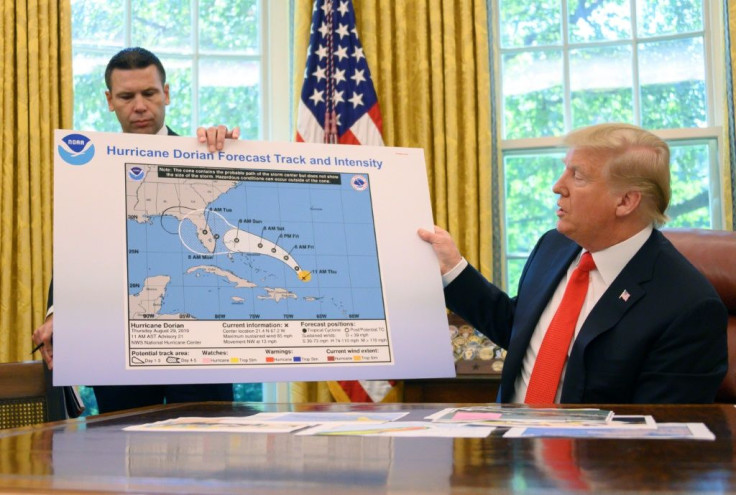 US President Donald Trump says Florida was lucky to escape a hit from Hurricane Dorian edness from the Oval Office at the White House in Washington, DC, September 4, 2019.
