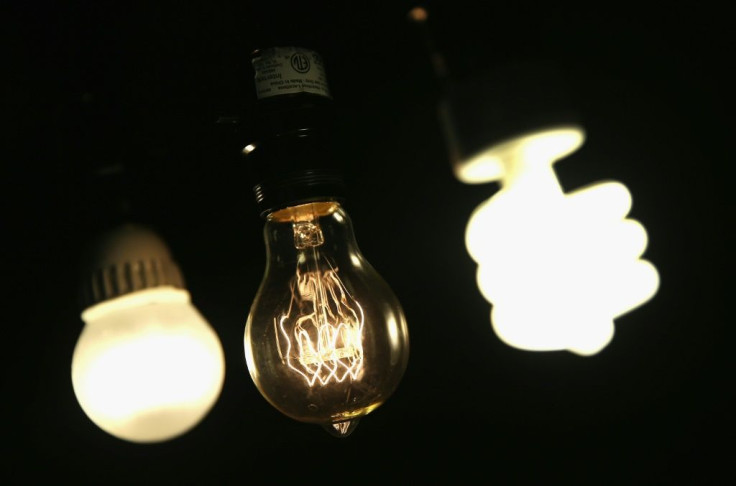 A vintage-style incandescent light bulb (C) is shown with an LED light bulb (L) and a compact florescent (CFL) light bulb