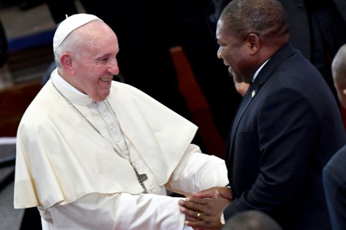 Handshake: Pope Francis and President Filipe Nyusi at an inter-religious meeting with youth