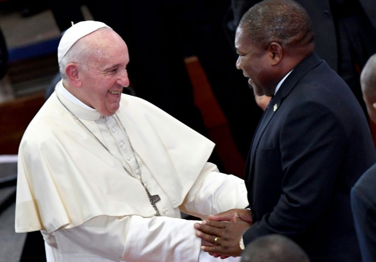 Handshake: Pope Francis and President Filipe Nyusi at an inter-religious meeting with youth