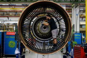 A man works with a jet engine at General Electric (GE) Celma, GE's aviation engine overhaul facility in Rio de Janeiro, Brazil