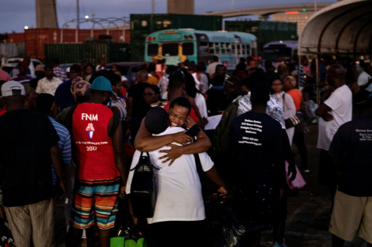 Hurricane Dorian refugees arrive at the Kendal GL Isaacs National Gym on September 6 in Nassau
