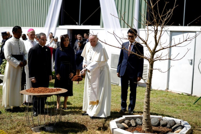 Pope Francis planted a baobab tree with Madagascar President Andry Rajoelina at the presidential palace in Antananarivo