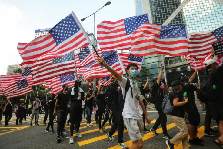 Many of those marching waved American flags