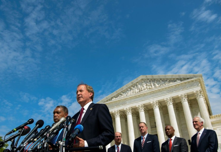 District of Columbia Attorney General Karl Racine (L) and Texas Attorney General Ken Paxton speak during the launch of an antitrust investigation into large tech companies outside of the US Supreme Court in Washington