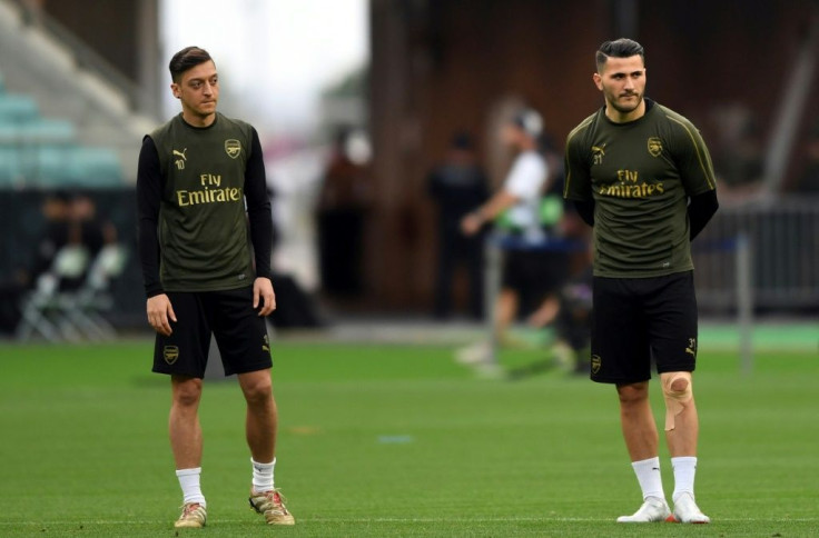 English football need to wake up to the threat to footballers and their families security in the wake of the attack on Arsenal stars Mesut Ozil and Sead Kolasinac security expert Alex Bomberg told AFP