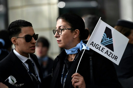 Aigle Azur employees rallied outside the French Transport Ministry in Paris on Monday, urging the government to help safeguard their jobs