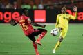 A file photo of star Zimbabwe forward Khama Billiat (R) playing against Uganda during the 2019 Africa Cup of Nations in Egypt