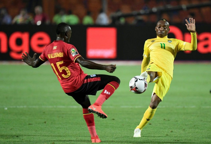 A file photo of star Zimbabwe forward Khama Billiat (R) playing against Uganda during the 2019 Africa Cup of Nations in Egypt