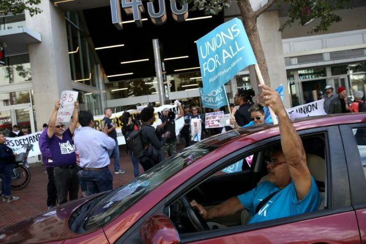 Rideshare drivers rallied on August 27 in support of California law to require firms such as Uber and Lyft to treat them as employees instead of independent contractors