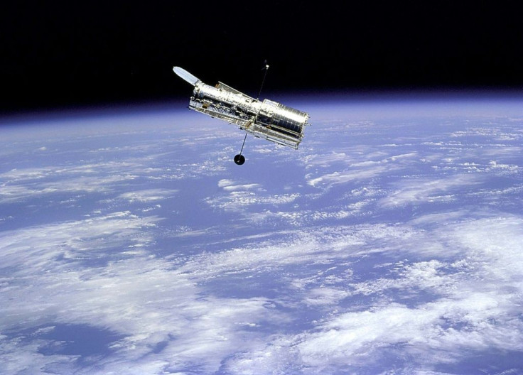 The Hubble Space Telescope, the world's first space telescope which has revolutionized astronomy, as seen from the Space Shuttle Discovery