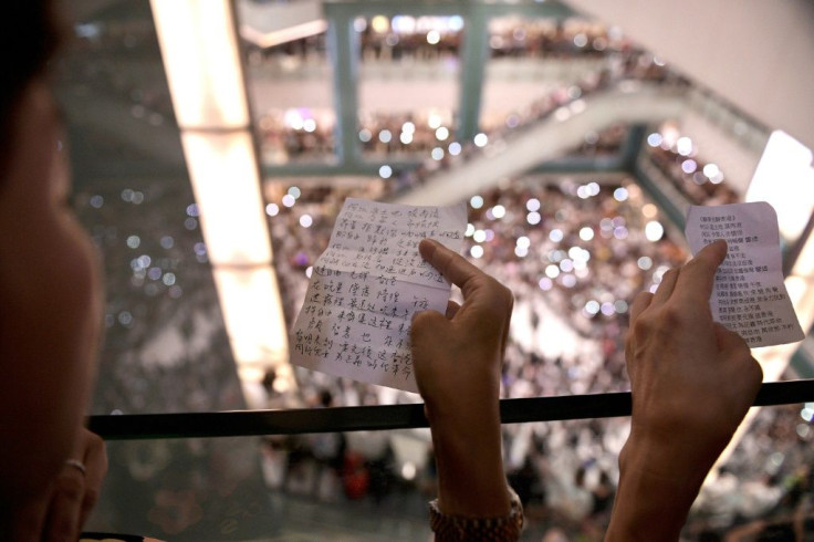 Protesters have gathered at Hong Kong malls to sing a new anthem penned by an anonymous composer