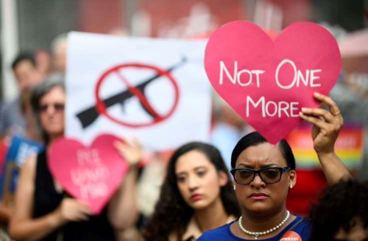 Protestors take part in a rally against gun violence calling for background checks on gun sales in August 2019