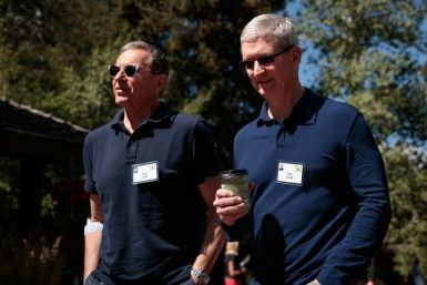 Bob Iger, left, chief executive officer of The Walt Disney Company, walks with Tim Cook, chief executive officer of Apple Inc., as they attend the Allen & Company Sun Valley Conference on July 6, 2016