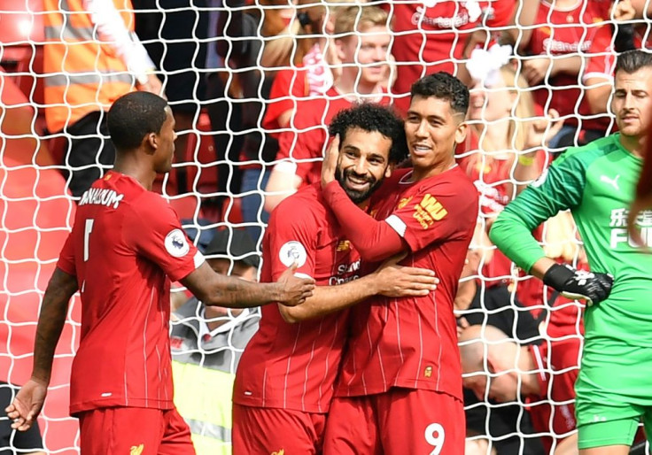 Roberto Firmino (right) teed up Mohamed Salah (centre) for Liverpool's third goal against Newcastle