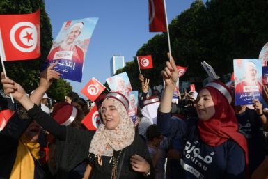 Supporters of Ennahdha candidate Abdelfattah Mourou attend an event on Thursday, as campaigning came to a close in Tunisia's presidential poll