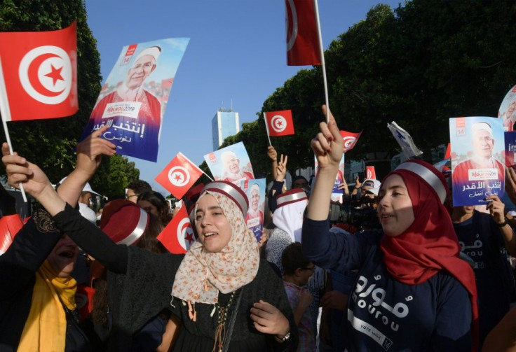 Supporters of Ennahdha candidate Abdelfattah Mourou attend an event on Thursday, as campaigning came to a close in Tunisia's presidential poll