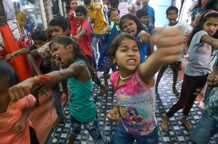 At Baburao Ladsaheb's "Five Star Acting Dancing Fighting Classes" in Mumbai's Dharavi, pupils learn the steps to famous Bollywood dances