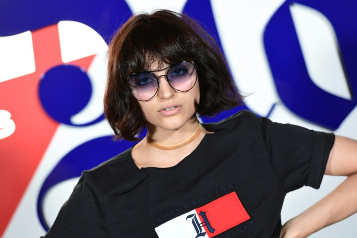 As the fashion world looks to go green, Italian influencer Federica Messaggeri poses during the presentation of the 'Tommy X Lewis' collection, a collaboration between US designer Tommy Hilfiger and British Formula One driver Lewis Hamilton