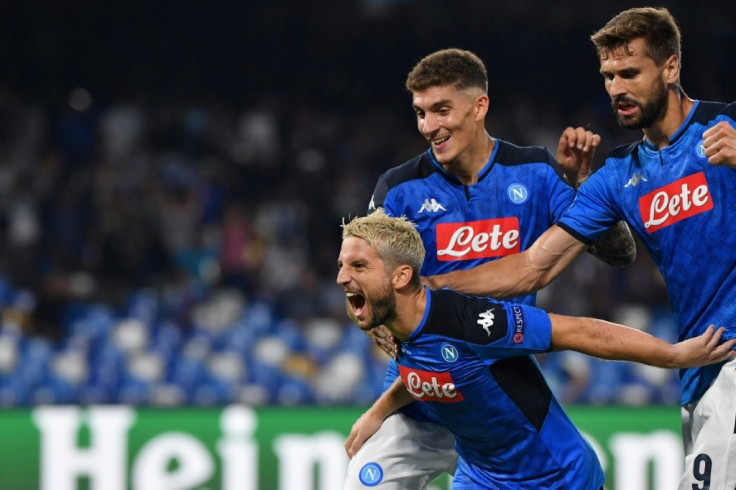 Napoli's Dries Mertens (Front) celebrates after scoring a penalty against Liverpool in their Champions League Group E match