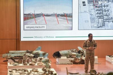 Saudi defence ministry spokesman Turki bin Saleh al-Malki displays pieces of what he said were Iranian cruise missiles and drones recovered from the attack site that targeted Saudi Aramco's facilities