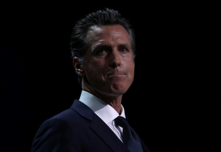 Goveror Gavin Newsom signed a new California law that requires rideshare firms such as Uber and Lyft to treat its contract drivers as employees