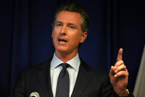 California Gov. Gavin Newsom said a law he signed requiring rideshare firms to treat drivers as employees would be a step toward "creating lasting economic security"