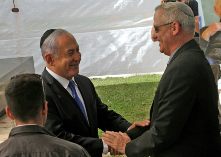 Israeli opposition leader Benny Gantz did not immediate respond to Netanyahu's call for a unity government but the two men exchanged greetings at a Jerusalem memorial service for Shimon Peres