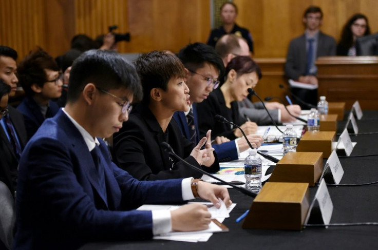Prominent activist Joshua Wong (L) and Cantopop star Denise Ho (C) testified before a congressional commission about the pro-democracy movement in Hong Kong