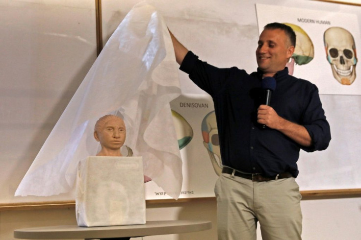 Israeli Professor Liran Carmel, of the Hebrew University in Jerusalem, reveals the first model of man's long-lost Denisovan cousin on September 19, 2019