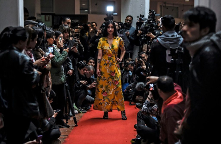 A model shows off a kimono during a fashion show by former FARC combatants in Bogota