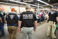 US Immigration and Customs Enforcement (ICE) and Homeland Security Investigations (HSI) officers execute search warrants on August 7, 2019, as part of a mass roundup of undocumented immigrants in the southeastern US state of Mississippi