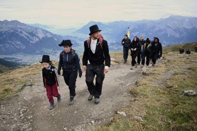 The solemn two-hour "funeral march" led up the side of Pizol mountain in northeastern Switzerland to the foot of the rapidly melting ice formation