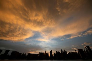 The sun sets behind the skyline of midtown Manhattan in New York City -- rather than falling, the world's carbon dioxide grew two percent in 2018