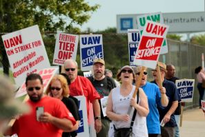 Members of the United Auto Workers (UAW) and supporters picket outside the General Motors Detroit-Hamtramck Assembly plant in Detroit, Michigan, as they strike on September 22, 2019