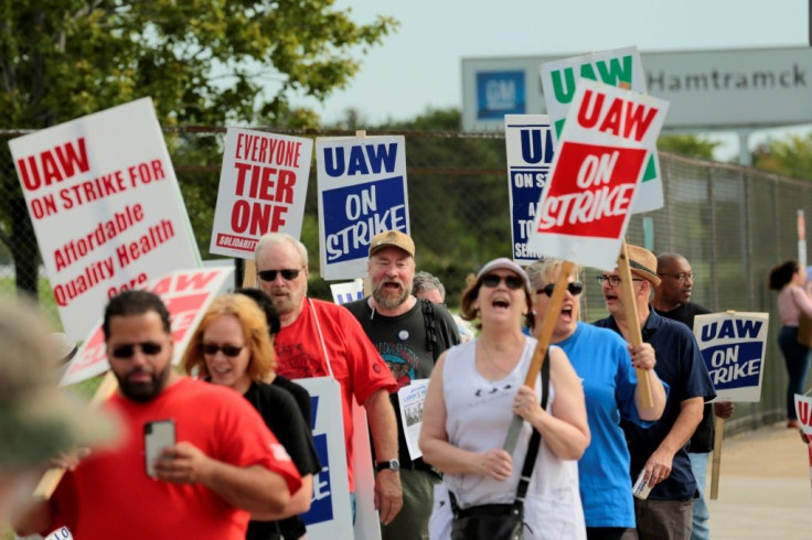 Members of the United Auto Workers (UAW) and supporters picket outside the General Motors Detroit-Hamtramck Assembly plant in Detroit, Michigan, as they strike on September 22, 2019