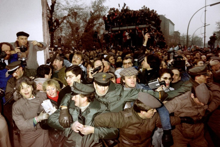 East and West German police struggled to contain the crowds of East Berliners flowing through an opening made in the Berlin wall at Potsdamer Square