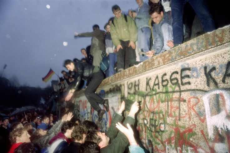 As the wall began to be dismantled, Berliners set about removing chunks of it as souvenirs with hammers and chisels