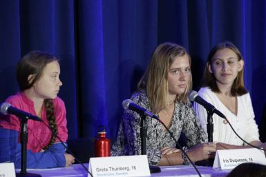 Greta Thunberg (L) and French activist Iris Duquesne (C) attend a press conference where 16 children from across the world presented their official complaint on the climate crisis to the United Nations